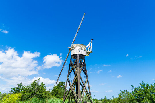 Boardman's drainage mill on the Norfolk Broads National Park in the UK against a blue sky