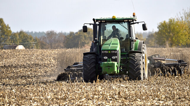 Kyiv, Ukraine, 26.10.2024. tractor in a field, tractor with a plow on an agricultural field. working in the field, soil preparation, agriculture. agricultural technology, farmland. harvest. Editorial