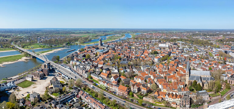 Historic riverside city with bridge across a wide river in Europe