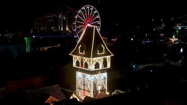 Capivari Village In Campos Do Jordao Sao Paulo Brazil. Breathtaking Aerial View Of Famous Ferris Wheel Of The City. Night Illuminated Skyline. Cities Of The World Landscape.