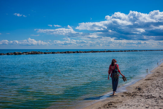 Beachgoers sunbathe on Centre Island Beach, which is located near the city of Toronto