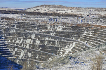 Obraz premium Aerial view of Asbestos mine, Asbestos, Quebec, Canada. Asbestos is a set of six naturally occurring silicate minerals used commercially for their desirable physical properties.