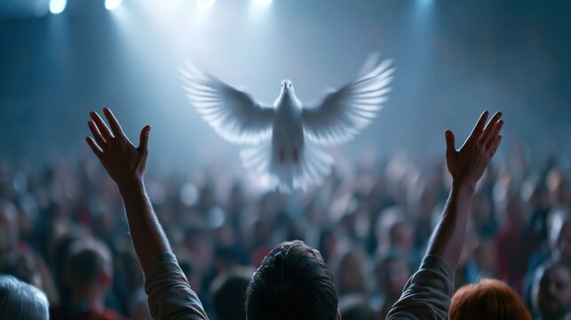 Crowd of people raising hands worshiping the Holy Spirit flying over the crowd of believers	

