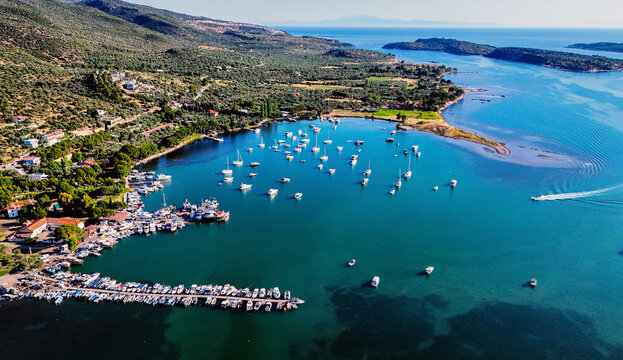 Aerial views of the coastal area off Bademli Neighborhood in Dikili, İzmir, Turkey, featuring Kalem Island, Garip Island, Aquarium Bay, Pissa Bay, and Hanımın Bay.