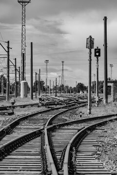 converging iron railway tracks and active control signals, emphasizing industrial engineering and urban transit architecture