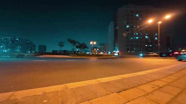 Dubai, United Arab Emirates &ndash; Night traffic timelapse featuring cars, buses, taxis, and other vehicles moving along a busy urban road. Cinematic 4K footage capturing city lights, transportation, and m