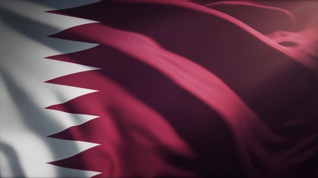 Close-up abstract view of the richly textured maroon and white fabric of the Qatar flag rippling in the wind