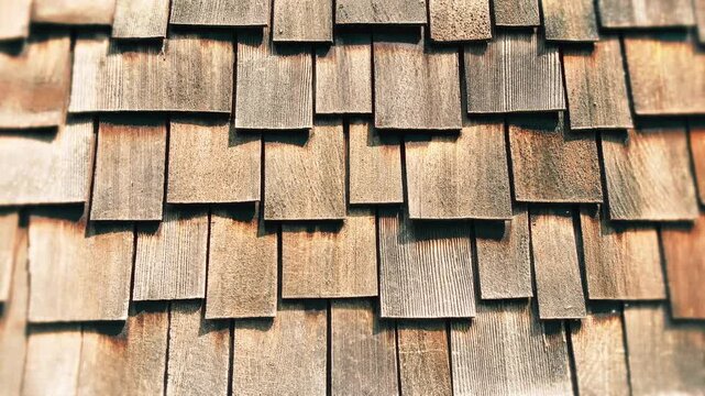 Warm wooden shingles wall texture detail, traditional Black Forest architecture as a rustic copy space background for nature craft and regional content 16:9