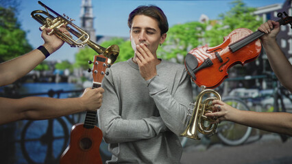 Fototapeta premium Man touching chin, surrounded by violin trumpet and ukulele on a street by a canal with bicycles and buildings; contemplative indecision.