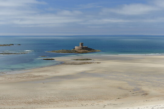 St. Ouens Bay, Jersey, U.K. Natural beach with 19th century Rocco tower.