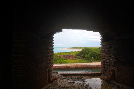 Tropical Coastline View Framed by Fort Window Ruin