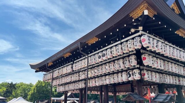 Large shrine pavilion covered with rows of white paper lanterns
