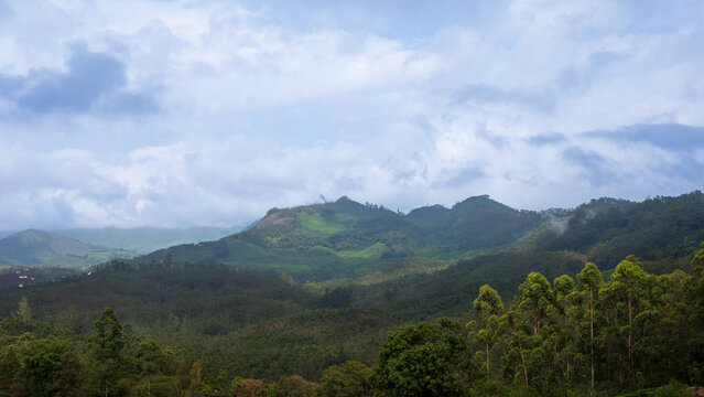 Panoramic View of Misty Hills and Lush Green Valleys in Munnar, Kerala, India