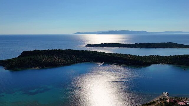Aerial views of the coastal area off Bademli Neighborhood in Dikili, İzmir, Turkey, featuring Kalem Island, Garip Island, Aquarium Bay, Pissa Bay, and Hanımın Bay.
