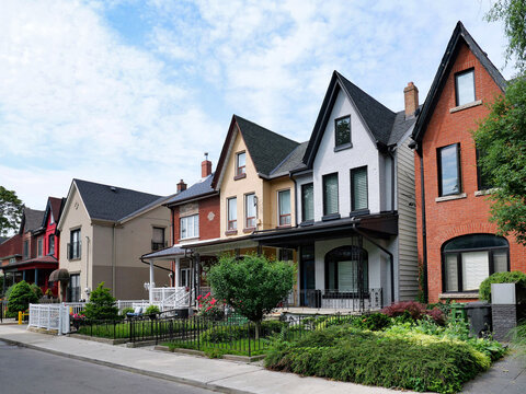 Street of semi-detached houses in pastel colors