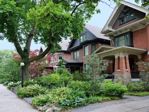 street of large brick houses with gables