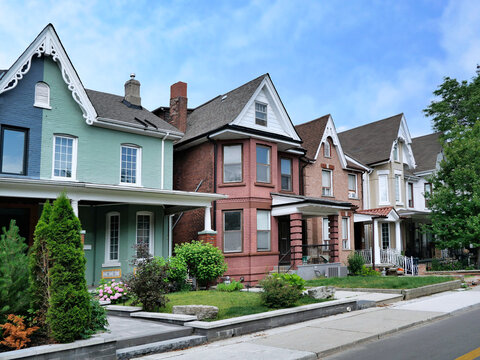 Street of semi-detached houses in pastel colors