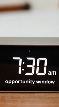Digital alarm clock displays 730 am text opportunity window. Time concept for business appointment or morning chance. Modern device for deadline reminder and start day.