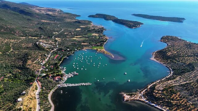 Aerial views of the coastal area off Bademli Neighborhood in Dikili, İzmir, Turkey, featuring Kalem Island, Garip Island, Aquarium Bay, Pissa Bay, and Hanımın Bay.