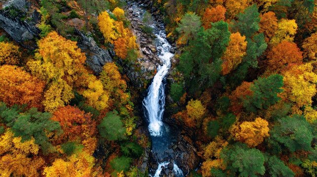 Waterfall cascading through colorful autumn forest