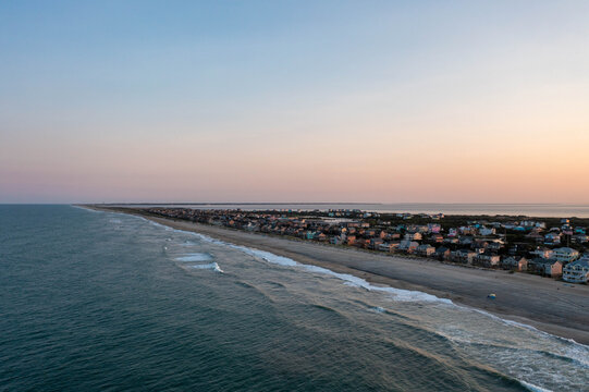 Aerial View of Avon North Carolina at Dusk with a Thin Strip of Barrier Island by the Atlantic Ocean