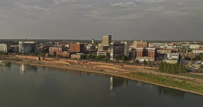 Evansville Indiana Aerial v1 establishing shot, flyover Ohio river capturing views of waterfront town center and buildings reflecting on the calm waters - Shot with Mavic 3 Pro Cine - September 2023