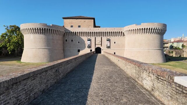 Rocca Roveresca Castle of Senigallia, Ancona and its access bridge, with full day light in summer time. Building recently cleaned in 2026. Front side view, horizontal footage panning.