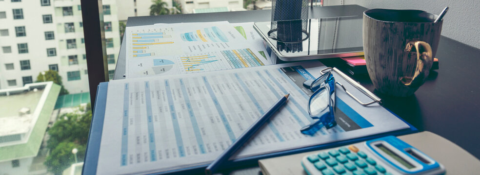 Banner Business Graphs charts office desk with copy space. Surfing internet online technology lifestyle. Banner Financial Planning Account Database Report. Technology lifestyle. Finance Excel graph