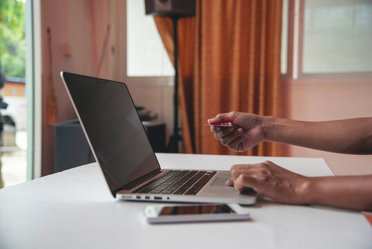 Banner Businesswoman hands type on laptop writing on notebook meeting at office desk. Freelance girl work from home via internet call conference sitting at home office morning time. Close up women