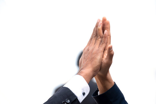 Teamwork high five as team together hands raise up greeting power tag teams. Diversity multiethnic two people success unity togetherness in Volunteer community. Collaborate Business partner win teams