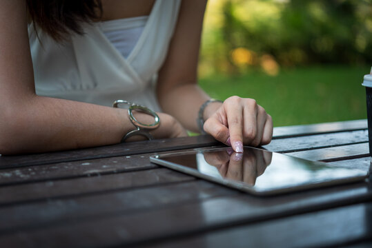 Woman hands holding mobile phone outdoor surfing internet online technology lifestyle. Woman hands writing on Agenda. Technology lifestyle. Smart Business woman note and schedule to set timetable