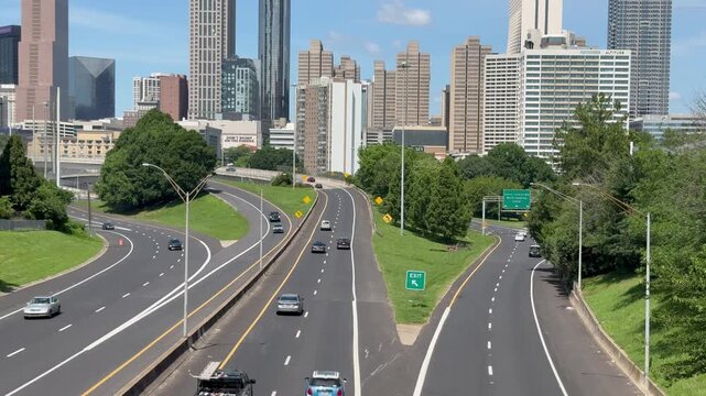 Cars headed towards downtown Atlanta on the freeway passing under Jackson Street Bridge in Georgia. 