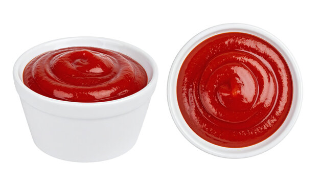 Ketchup sauce bowls containing fresh red tomato condiment for dipping served in small white porcelain ramekins viewed from side and top angles&nbsp;
