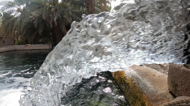 Water flowing into a pool at The Garden of Salman Al Farsi (RA) in Madinah, Saudi Arabia.