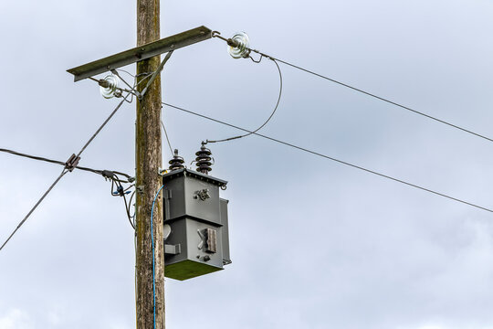 Pole mounted electricity distribution transformer on rural power line