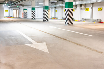 Obraz premium Underground parking garage, empty modern industrial interior