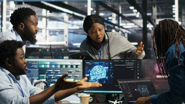 Data center engineering team react to a cyberattack on a computer, securing server equipment and protecting confidential data.