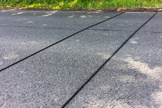 Traffic counting tubes across country road for vehicle monitoring