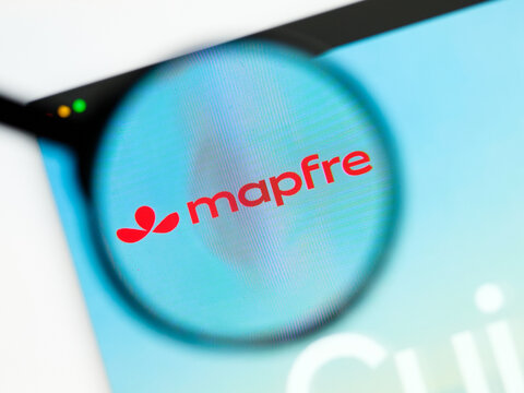 Milan, Italy 2026, 5 Jul Closeup of Mapfre website page on a laptop screen. Focus on Mapfre logo under a magnifying glass.