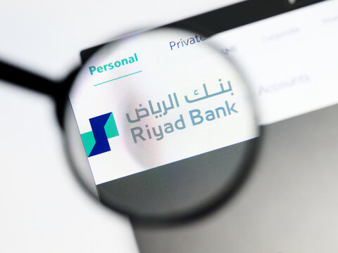 Milan, Italy 2026, 5 Jul Closeup of Riyad Bank website page on a laptop screen. Focus on Riyad Bank logo under a magnifying glass.