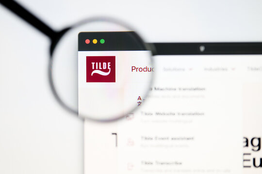 Milan, Italy 2026, 5 Jul Closeup of Tilde website page on a laptop screen. Focus on Tilde logo under a magnifying glass.
