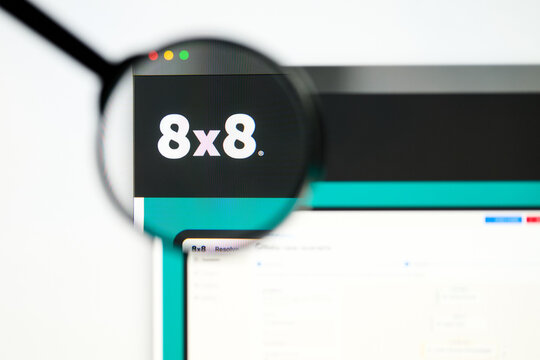 Milan, Italy 2026, 5 Jul Closeup of 8x8 website page on a laptop screen. Focus on 8x8 logo under a magnifying glass.