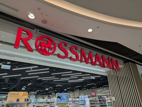 Warsaw, Poland,May 03, 2026. Bright red corporate logo signboard of Rossmann drugstore installed above the main commercial department entrance. High quality photograph.
