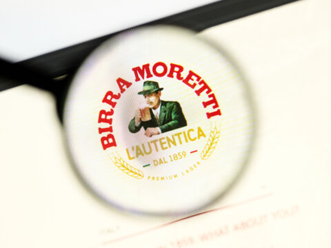 Milan, Italy 2026, 5 Jul Closeup of Birra Moretti website page on a laptop screen. Focus on Birra Moretti logo under a magnifying glass.