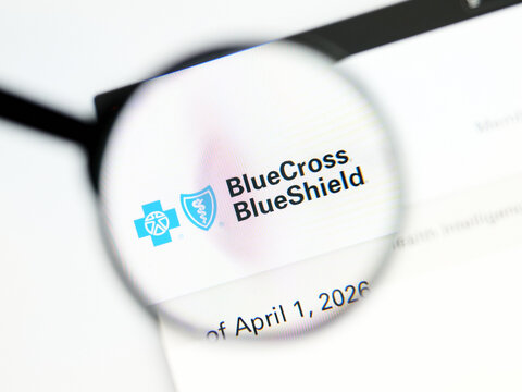 Milan, Italy 2026, 5 Jul Closeup of Blue Cross Blue Shield website page on a laptop screen. Focus on Blue Cross Blue Shield logo under a magnifying glass.