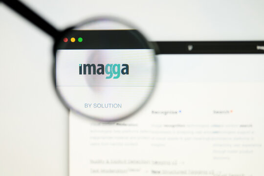 Milan, Italy 2026, 5 Jul Closeup of Imagga website page on a laptop screen. Focus on Imagga logo under a magnifying glass.