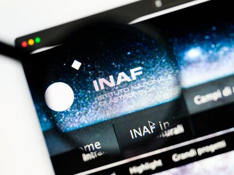 Milan, Italy 2026, 5 Jul Closeup of INAF website page on a laptop screen. Focus on INAF logo under a magnifying glass.