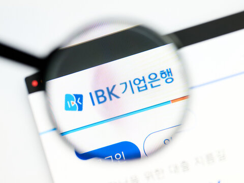 Milan, Italy 2026, 5 Jul Closeup of Industrial Bank of Korea IBK website page on a laptop screen. Focus on Industrial Bank of Korea IBK logo under a magnifying glass.