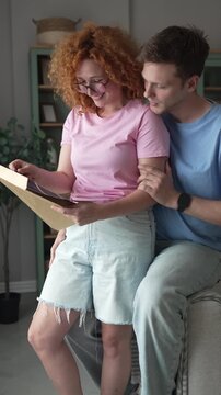 Happy young couple looking at pregnancy ultrasound scan