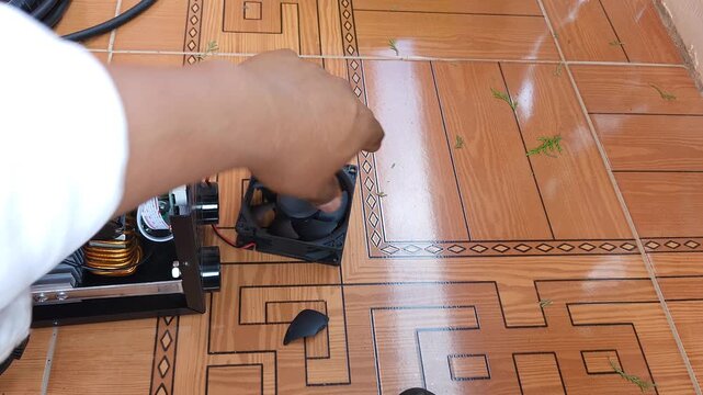 Showing broken plastic cooling fan extracted from mini welder